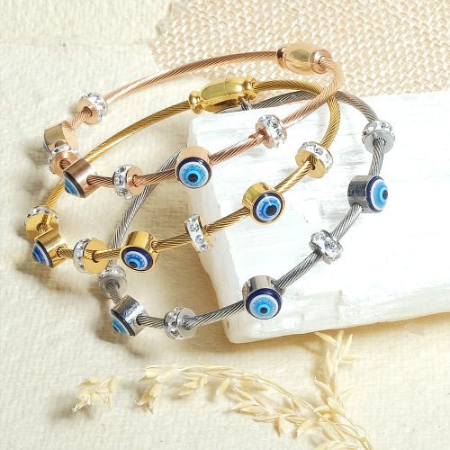 Elegant dainty Evil eye bangle with an anti-tarnish finish, available in rosegold, silver, and golden, perfect for stacking, everyday elegance, and chic versatile styling.