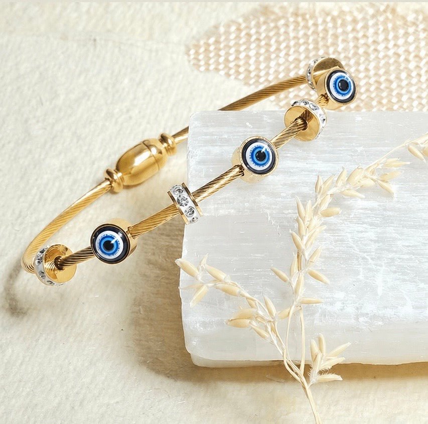 Elegant dainty Evil eye bangle with an anti-tarnish finish, available in rosegold, silver, and golden, perfect for stacking, everyday elegance, and chic versatile styling.