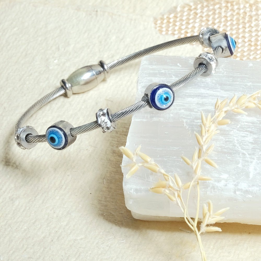 Elegant dainty Evil eye bangle with an anti-tarnish finish, available in rosegold, silver, and golden, perfect for stacking, everyday elegance, and chic versatile styling.