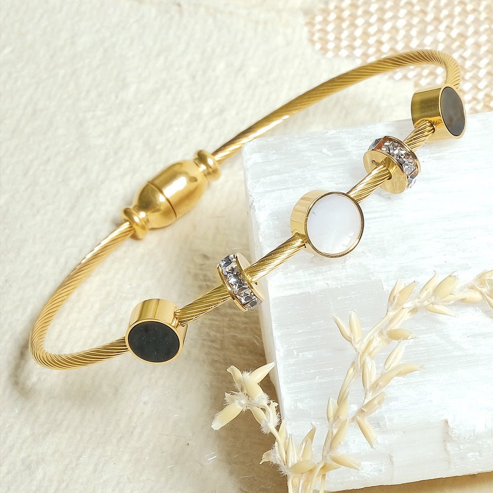 Elegant lightweight magnetic lock bangle crafted from anti-tarnish alloy with a sleek minimalist design, available in rose gold, gold, and silver, perfect for everyday styling, stacking with watches and bangles, and thoughtful gifting.
