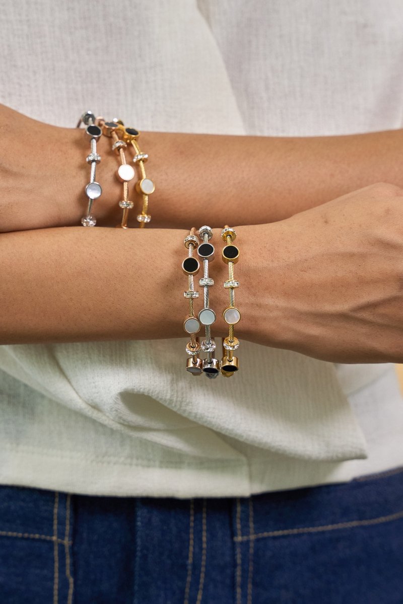 Elegant lightweight magnetic lock bangle crafted from anti-tarnish alloy with a sleek minimalist design, available in rose gold, gold, and silver, perfect for everyday styling, stacking with watches and bangles, and thoughtful gifting.
