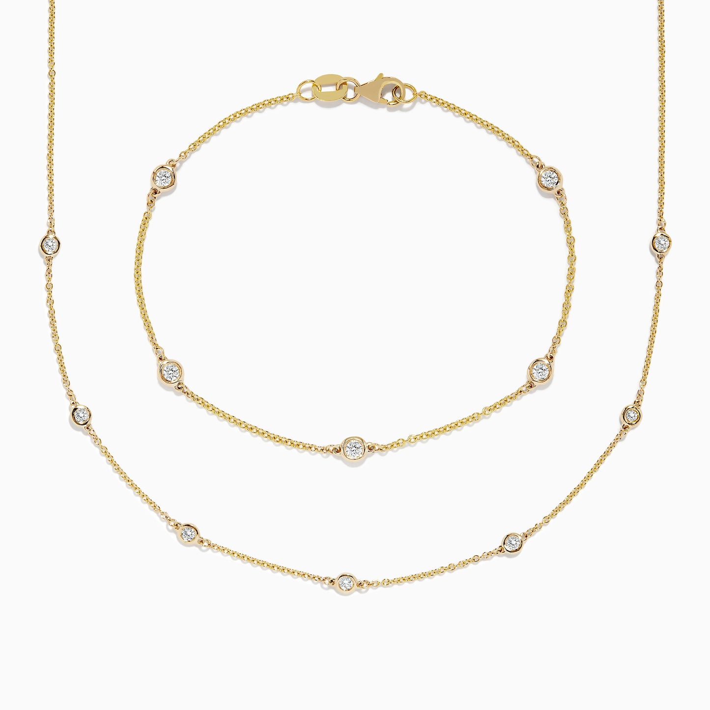 The DOro 14K Gold Diamond Station Necklace and Bracelet Set (0.59 TCW) features evenly spaced round diamonds on delicate chains, beautifully displayed on a white background.