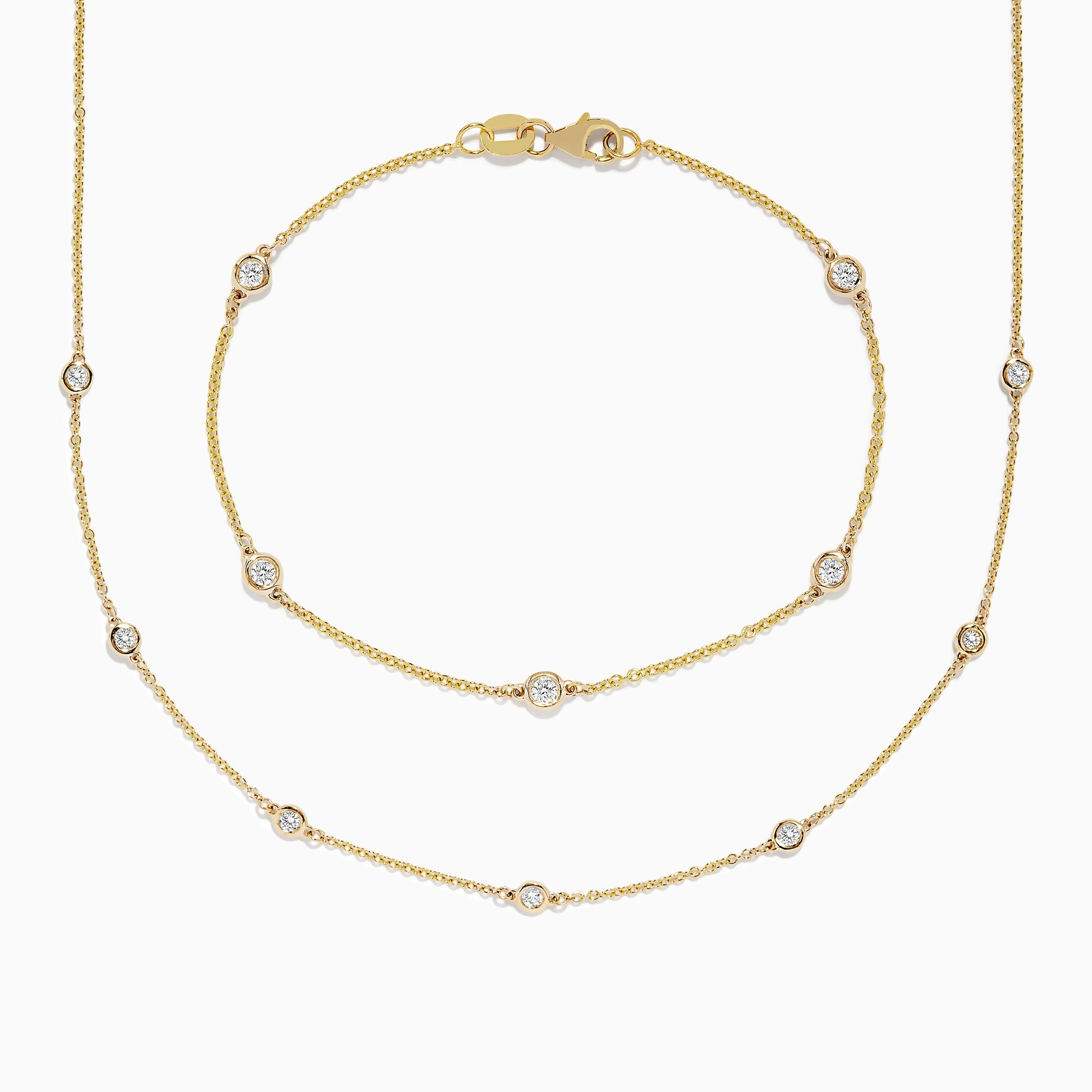 The DOro 14K Gold Diamond Station Necklace and Bracelet Set (0.59 TCW) features evenly spaced round diamonds on delicate chains, beautifully displayed on a white background.