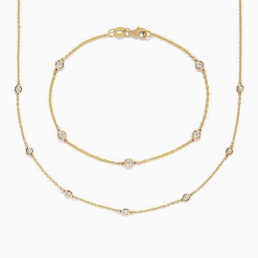 The DOro 14K Gold Diamond Station Necklace and Bracelet Set (0.59 TCW) features evenly spaced round diamonds on delicate chains, beautifully displayed on a white background.
