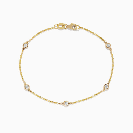 The DOro 14K Gold Diamond Station Necklace and Bracelet Set (0.59 TCW) features evenly spaced round diamonds on delicate chains, beautifully displayed on a white background.