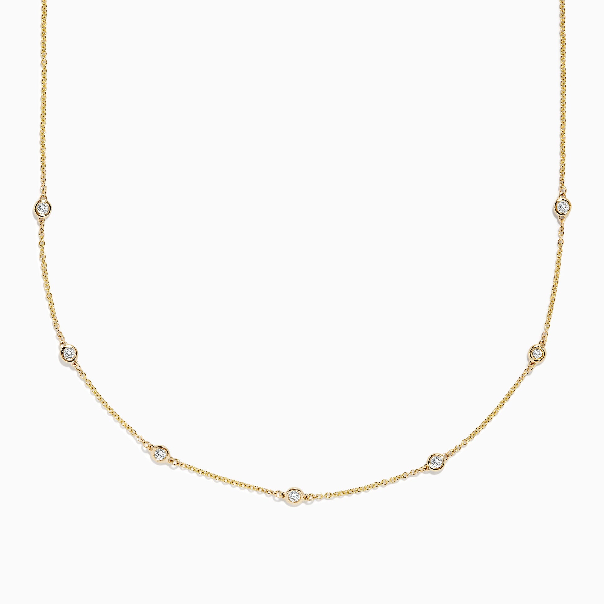 The DOro 14K Gold Diamond Station Necklace and Bracelet Set (0.59 TCW) features evenly spaced round diamonds on delicate chains, beautifully displayed on a white background.